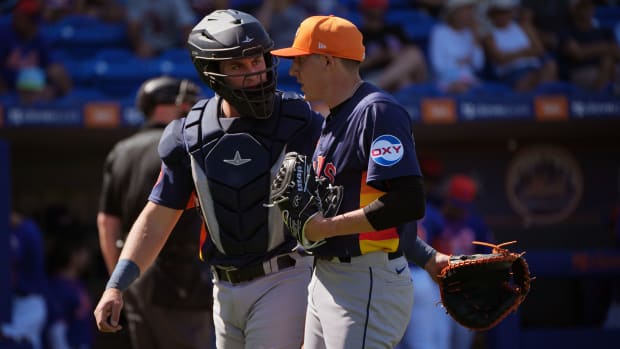 Feb 25, 2024; Port St. Lucie, Florida, USA; Houston Astros catcher CJ Stubbs (80) and pitcher AJ Blubaugh (69) meet as they walk back to the dugout during the game against the New York Mets at Clover Park. Mandatory Credit: Jim Rassol-USA TODAY Sports